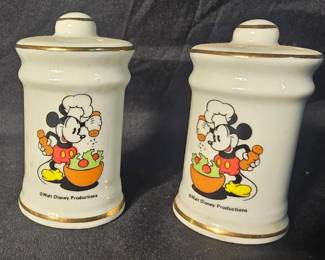 Vtg Walt Disney Chef Mickey Shakers White ceramic Features chef Mickey mouse making a salad 2.75" tall All original parts 1 shaker has a large crack that seems to be cosmetic Needs cleaning