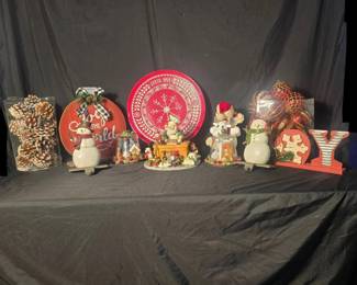 Christmas Snowman & Holiday Decor Collection A cheerful mixed Christmas décor collection with snowmen, elves, rustic signs, pinecones and tabletop pieces for creating an easy coordinated holiday display.  Pair of snowman stocking holders Santa with elves tabletop figure Plush holiday moose Two glass-enclosed Christmas scenes with wood bases Wooden “JOY” sign Wooden “Joy to the World” décor Red “Live Merry” snowflake plate, approx. 14" Glass cylinder with frosted pinecones Additional holiday décor as shown See photos for measurements, condition and all items included Market Insight & Estimated Market Value: A nice variety of rustic and traditional Christmas pieces that can decorate a mantel, entryway, buffet or holiday tabletop all at once.  Estimated Market Value: $65–$100