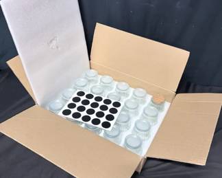 Set of 20 Ribbed Glass Storage Jars With Lids Set of 20 matching ribbed glass jars in the original divided box, great for spices, herbs, craft supplies, or small-item organization.  19 jars have fitted plastic lids 1 jar has a cork lid Includes black label stickers Original divided storage/packing box included See photos for measurements and details   Market Insight & Estimated Market Value: A ready-to-use matching set with a clean vintage-inspired look that's equally useful for kitchen storage, crafting, or organizing.    Estimated Market Value: $30–$50