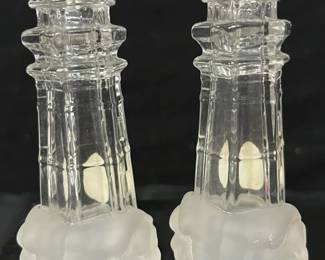 Lenox Crystal Lighthouse Salt & Pepper Shakers Pair of Lenox crystal lighthouse salt and pepper shakers featuring clear lighthouse towers with frosted wave-style bases. Both retain Lenox stickers.  Matching pair Clear and frosted crystal Lenox labeled Please see photos for measurements and condition   Market Insight & Estimated Market Value: A charming coastal collectible with Lenox name recognition, perfect for lighthouse collectors or nautical décor.    Estimated Market Value: $25–$40