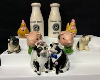 Barnyard Animal Salt & Pepper Shaker Collection Fun farmhouse-style collection of animal salt and pepper shakers featuring pigs, chickens, cows, and dogs. The bride-and-groom cow pair is an especially cute centerpiece for the group.  Includes 5 pairs / 10 shakers total Bride & groom cows Pink pigs, black & white pigs, chickens, and dogs “Country Fresh” milk-bottle style cow shakers Please see photos for measurements and condition   Market Insight & Estimated Market Value: A charming mix for salt-and-pepper shaker collectors or anyone decorating a farmhouse or country kitchen.    Estimated Market Value: $30–$50