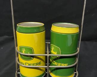 John Deere Salt & Pepper Shakers With Wire Caddy John Deere green and yellow metal salt and pepper shakers displayed in a handled wire caddy. Both are marked as officially licensed John Deere products and remove easily from the holder.  Includes 2 shakers and wire caddy Classic John Deere colors and logo Please see photos for measurements and condition   Market Insight & Estimated Market Value: A fun piece of John Deere kitchenware that also works well as farmhouse or tractor-themed display décor.    Estimated Market Value: $20–$35