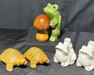 Frogs And Turtles Salt And Pepper Shakers One set of matching, white, frog salt and pepper shakers One set of salt and pepper shakers shaped like a frog and toadstool One set of matching turtle salt and pepper shakers All shakers are ceramic The white frog shakers have some crazing The turtle shakers show some signs of use All shakers still have the stoppers See pictures for details