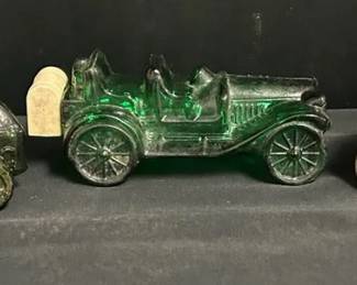 Three Vintage Avon Car Shaped Bottles Three vintage Avon car shaped bottles The silver bottle is full of perfume The green bottles are empty No noticeable chips or cracks Needs cleaning See pictures for details