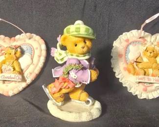Enesco Cherished Teddies Figurines & Plaques With Boxes Three Enesco Cherished Teddies collectibles with original packaging, including a winter skating figurine and two heart-shaped hanging plaques.  “It’s A Holiday On Ice” Adam skating figurine, #269751 “Heart to Heart” plaque “My Cherished One” plaque Original boxes included Please see photos for condition Market Insight & Estimated Market Value: A sweet grouping for Cherished Teddies collectors, with original packaging adding to the appeal.  Estimated Market Value: $25–$40
