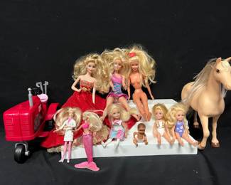 Barbie Dolls, Tractor, Horse & Accessories Fun mixed Barbie collection with dolls from different eras, Barbie kids, a large Barbie tractor and horse. Several dolls have Mattel/Barbie markings, including examples dated 1993 and 2003.  Includes adult-size Barbie dolls, smaller dolls and baby Barbie tractor and horse Assorted clothing included Some dolls have marks/wear from previous play Outfits/accessories may not be original to individual dolls Please see photos for everything included and condition Market Insight & Estimated Market Value: A nice play-ready group with plenty of dolls plus the larger tractor and horse accessories adding extra appeal.  Estimated Market Value: $45–$75