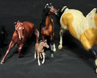 Breyer & Assorted Horse Figurine Collection Collection of five horse figurines in assorted sizes and poses, including pieces marked Breyer/Flicka © 2006 Fox. A fun group for horse lovers, Breyer collectors, display, or restoration projects.  Includes 5 horse figurines Some have missing/broken hooves and ear damage Finish/paint shows noticeable rubbing and wear from age and use Please see photos for measurements, markings and condition   Market Insight & Estimated Market Value: The Breyer/Flicka connection adds collector appeal, while the mixed sizes and condition make this a good display, restoration, or custom-paint group.    Estimated Market Value: $25–$45