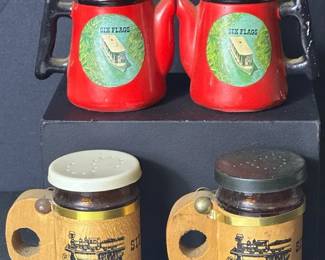 Vintage Six Flags Over Georgia Salt & Pepper Shaker Sets Two souvenir salt and pepper shaker sets from Six Flags Over Georgia, including red teapot-style shakers and wooden mug-style shakers. Fun pieces of vintage amusement park memorabilia.  Two sets included Missing stopper, scuffs, and other wear One gold-tone piece is broken Need cleaning See photos for measurements and condition Market Insight & Estimated Market Value: Vintage Six Flags souvenirs have nostalgic appeal for theme park and Georgia memorabilia collectors, especially these unusual shaker designs.  Estimated Market Value: $20–$35