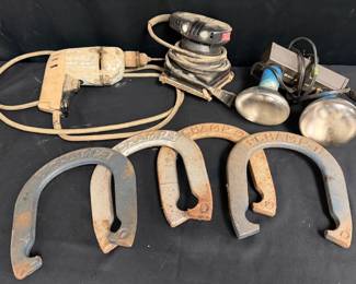 Sears Craftsman Sander, Vintage Drill, Bell & Howell Shop Light & Horseshoes Useful garage and workshop assortment with two corded power tools, a Bell & Howell dual-lamp clamp-on shop light, and four heavy horseshoes.  Sears Craftsman 1/4-sheet finishing sander, Model 315.116021, 1/6 HP Corded drill; maker not identified Bell & Howell dual-lamp clamp-on shop light Four horseshoes marked CHAMP 1 and CHAMP 2 All powered items tested and working Tools show considerable workshop use and need cleaning See photos for condition and details Market Insight & Estimated Market Value: A practical working-tool lot with older Craftsman appeal, plus a versatile clamp light and horseshoes for reuse or rustic projects.  Estimated Market Value: $40–$70