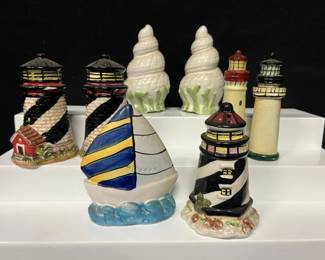 Nautical Lighthouse, Sailboat & Seashell Salt & Pepper Shakers Colorful ceramic salt and pepper shaker collection with classic coastal designs—great for a beach house, lake house, or nautical kitchen.  Includes 2 large lighthouses, 2 slim lighthouses, sailboat, and 2 seashell shakers One seashell has a chip at the tip Please see photos for condition and details   Market Insight & Estimated Market Value: A fun ready-made coastal collection with plenty of decorative appeal for nautical décor lovers.    Estimated Market Value: $25–$40