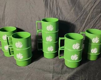 Vintage Tupperware Green Holiday Dove Mugs - Set of 11 Set of 11 vintage Tupperware stacking mugs in bright green with a white dove and olive branch design. Lightweight, durable, and easy to stack for compact storage.  11 mugs Tupperware #1312-52 Made in USA Hard plastic construction Need cleaning No noticeable damage; see photos for condition   Market Insight & Estimated Market Value: A fun retro Tupperware set with a great holiday color and dove motif, especially appealing for Christmas gatherings, camping, or vintage kitchen collections.    Estimated Market Value: $35–$55