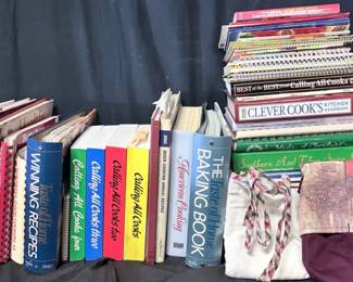 Large Collection of Cookbooks, Recipe Books & Aprons Big kitchen collection packed with cookbooks, community recipe books and cooking magazines covering everyday meals, baking, desserts, holidays, healthy cooking and more. Includes recognizable favorites from Taste of Home, Betty Crocker, Pillsbury, Kraft and Calling All Cooks, plus 2 aprons.  Large assortment of hardcover, softcover and spiral-bound cookbooks Includes regional/community-style cookbooks and specialty recipe publications 2 aprons included Please see photos for titles, condition and all items included   Market Insight & Estimated Market Value: A fun collection for anyone who loves old-school recipes, home cooking and browsing cookbooks for forgotten favorites.    Estimated Market Value: $60-$100