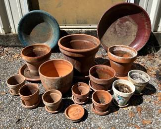 Assorted Terracotta Flower Pots & Bird Bath Bowls Nice garden grouping with 12 terracotta pots in assorted sizes plus two large terracotta bird bath bowls. Includes traditional pots, saucers and two painted floral pots.  Bird bath bowls approx. 20" and 16" diameter Large pots approx. 13" x 11"H Medium pots approx. 9" x 8"H Small pots approx. 4.5" x 3.5"H Show outdoor use, weathering and mineral deposits At least one piece has a visible crack; see photos closely for overall condition   Market Insight & Estimated Market Value: A ready-made collection for container gardening, herbs, flowers or adding established terracotta character to a patio or garden.    Estimated Market Value: $50–$80