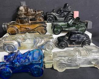 Vintage Set Of 8 Avon Car Decanters Sterling six car “Gold cadillac” Straight eight VW bug Blue dune buggy Electric car Reo Depot Wagon Please see pictures for approx measuremenrs and condition of item Clear car has chip on top as shown in pictures Silver/gold car top coat is peeling off due to age