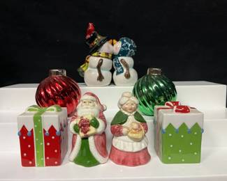 Christmas Holiday Salt & Pepper Shaker Collection Festive assortment of Christmas salt and pepper shakers featuring Mr. & Mrs. Claus, colorful presents, ornament-shaped shakers, and an adorable magnetic kissing snowman pair topped with a cardinal.  See photos for approximate measurements, condition, and all pieces included. Market Insight & Estimated Market Value: A cheerful mix for holiday tables, Christmas kitchen decor, or salt and pepper shaker collectors.  Estimated Market Value: $30–$50