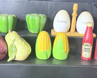 Food-Themed Salt & Pepper Shaker Collection Fun collection of kitchen-themed salt and pepper shakers featuring colorful fruits and vegetables, corn, green peppers, Heinz ketchup bottles, and a classic salt-and-pepper set with wooden holder.  Great for a retro kitchen display or shaker collector. Please see photos for condition, measurements, and all pieces included. Market Insight & Estimated Market Value: The Heinz ketchup pair is the standout here, while the colorful food designs make the entire group a fun collectible kitchen lot.  Estimated Market Value: $30–$50