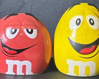 M&M’s Red & Yellow Character Salt and Pepper Shakers Fun M&M’s character salt and pepper shaker set featuring the classic Red and Yellow candy characters. Both are marked ©/TM Mars, Inc.  Ceramic shakers Approx. 2.5" tall Stoppers present Need cleaning See photos for condition Market Insight & Estimated Market Value: A colorful piece of M&M’s advertising memorabilia that’s fun for candy collectors, kitchen decor, or an M&M’s collection.  Estimated Market Value: $15–$25