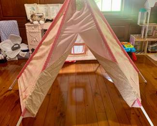 a large pink play teepee