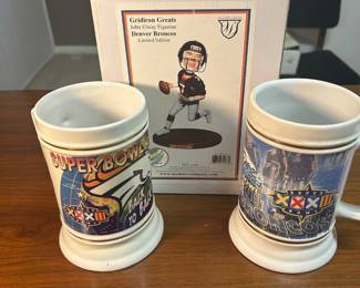Lot #97 Denver Broncos Super Bowl XXXII XXXIII Ceramic Steins & John Elway Figurine Set
