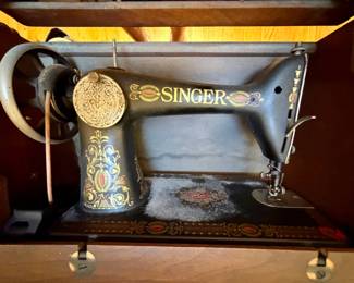 Singer Model Red Eye Treadle Sewing Machine with Cabinet