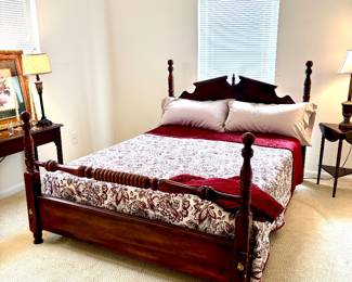 Traditional dark wood post queen bed