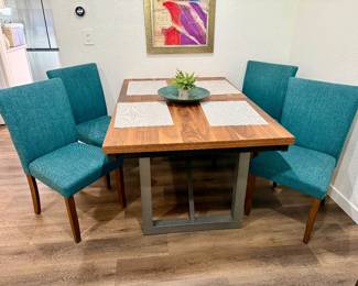 Dining table has 6 chairs plus a leaf