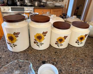 A Hyalyn Pottery ceramic canisters with sunflower transfer prints