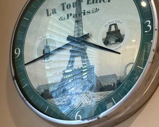 Round wall clock with Eiffel Tower
