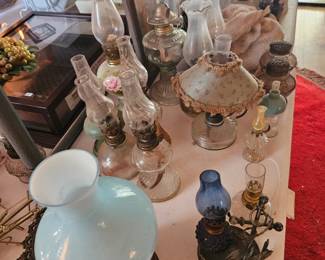 large collection of oil lamps, all sizes