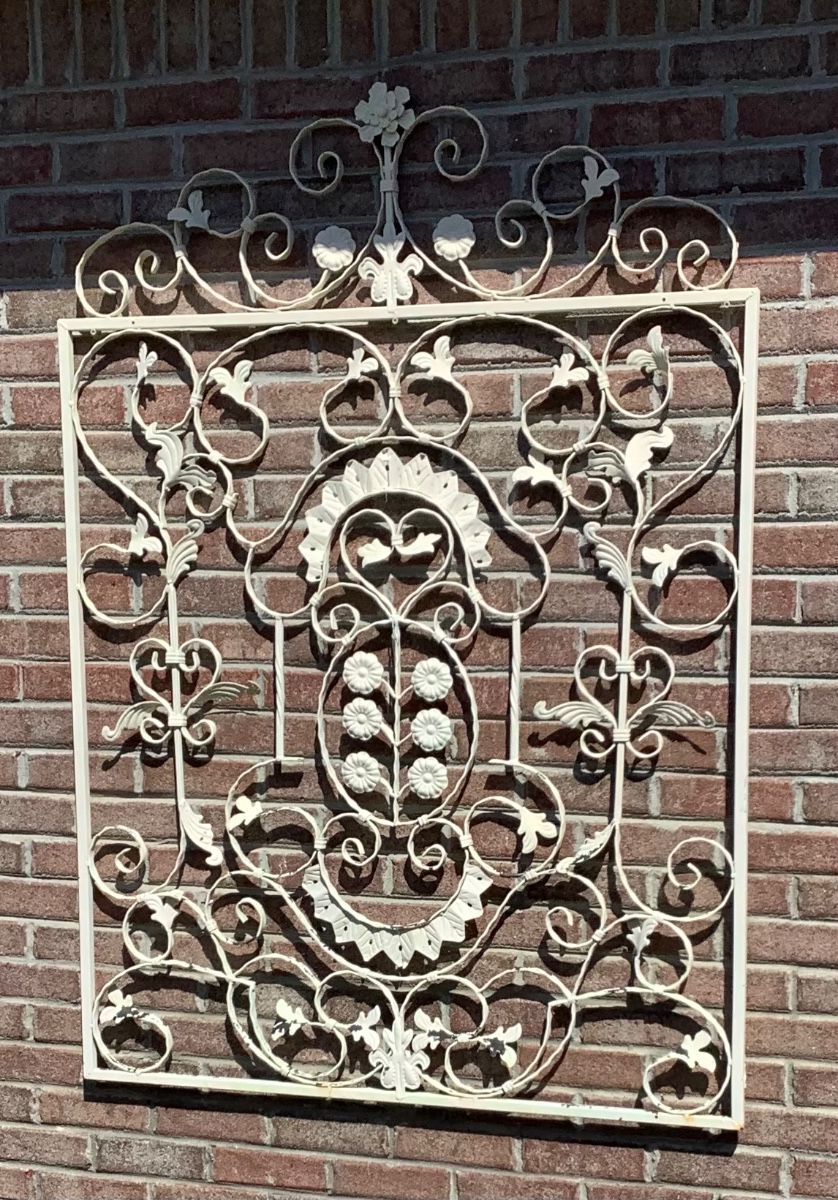 Big white metal hanger on side of house.
