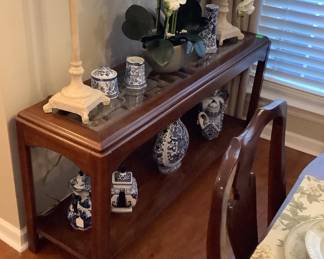 Sofa table with glass inserts,2 tall buffet lamps, gorgeous orchard, more blue and white collectibles.