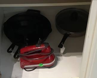 Iron skillets,more frying pans, red hand mixer.