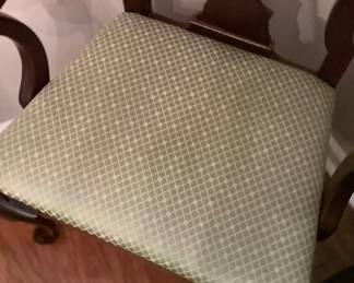Beautiful green seat fabric on dining chairs.