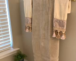 Towels and tall blue and white vase.