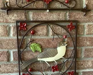 Metal hanger with holly and bird.