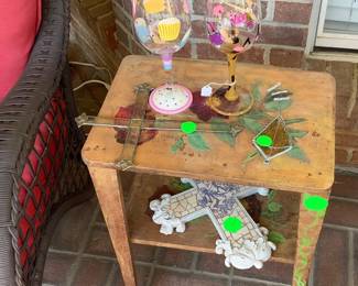 A close up of painted table with cross.