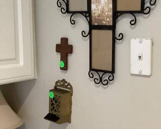 Crosses on kitchen wall.