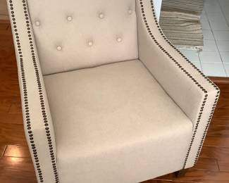 White chair with hob nails.