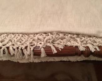 Beige throw at bottom of bed.