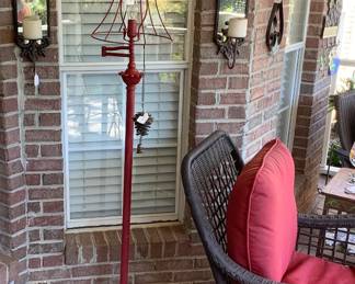 Red metal floor lamp, 2 sconces with mirrors and holding candles.