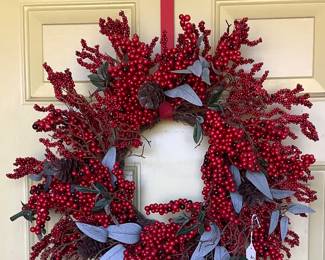 Red berry wreath on front on front pirch.