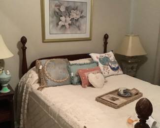 Antique bed with mattress and springs! Posts on top and bottom. Has matching end table on one side and brass table with glass top on the other side.