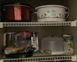 Crock pots and food in pantry.