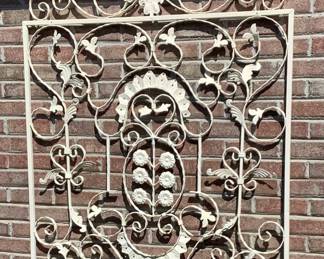Big white metal hanger on side of house.