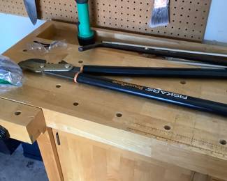 Cabinet in garage, choppers on top.
