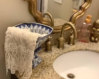 Beautiful blue and white standing holding lace hand towel.