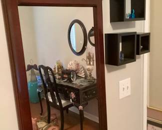 Long mahogany hanging mirror.