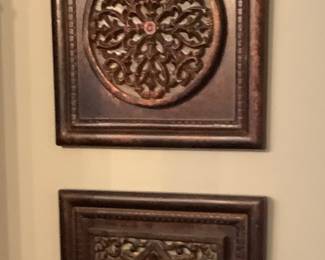 2 brown wall hangings.
