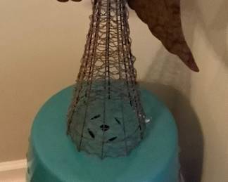 Round turquoise stand with metal Angel.