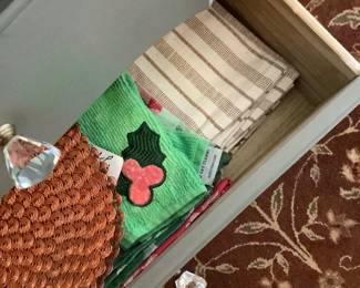 Places ats and dish towels.